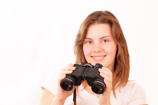 Smiling young girl with binoculars - Foto, immagini