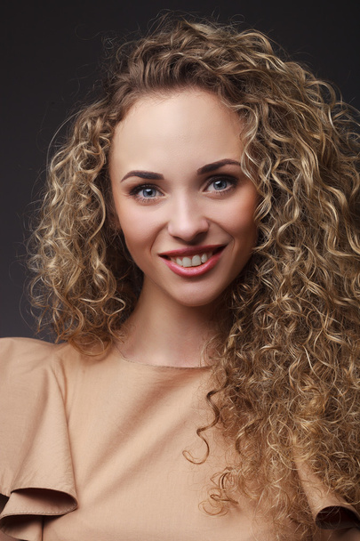 Portrait of woman with curly hair - Foto, Imagen