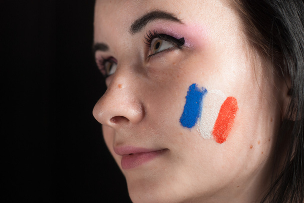 Painted woman face with flag of France - Фото, изображение