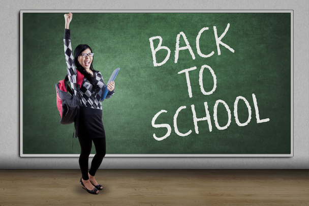 Happy student and text of Back to School - Foto, Imagem