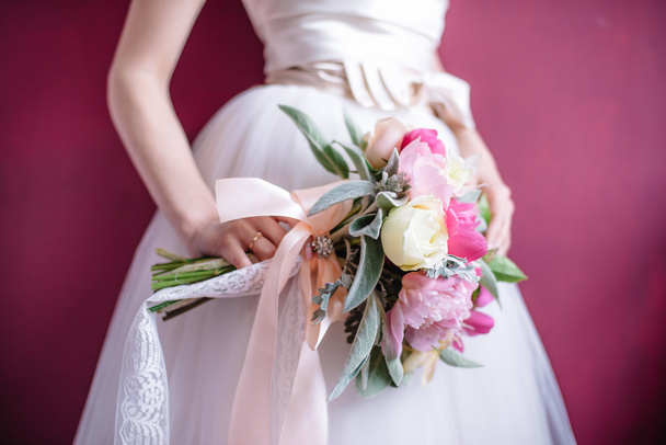 Beautiful wedding bouquet in hands of the bride - Fotoğraf, Görsel
