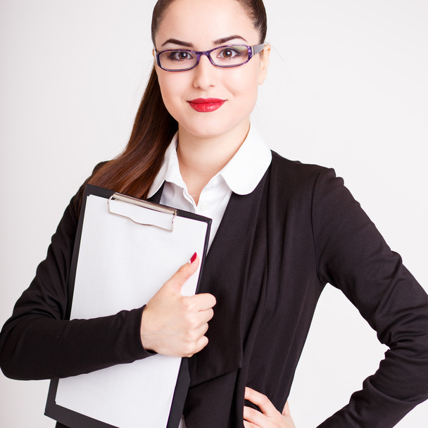 beautiful modern businesswoman in her office with a paper folder - Foto, Imagem