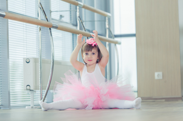 Adorable child dancing classical ballet in studio. - Foto, imagen