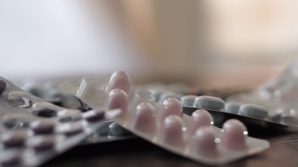 Isolated pills on a table - Záběry, video