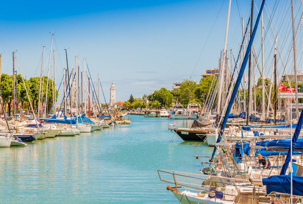 Boats moored in the harbor channel in Rimini, Italy - Photo, Image