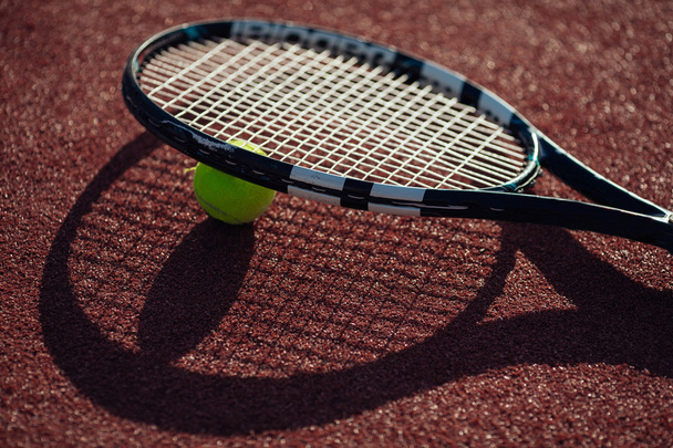 Close up view of tennis racquet and balls on the clay tennis cou - Photo, Image