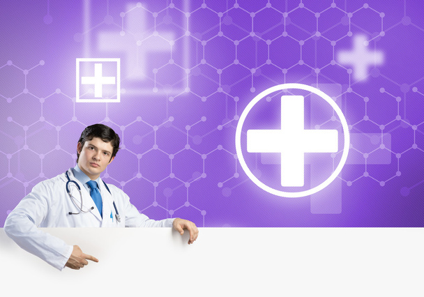 Doctor with white blank banner - Foto, imagen