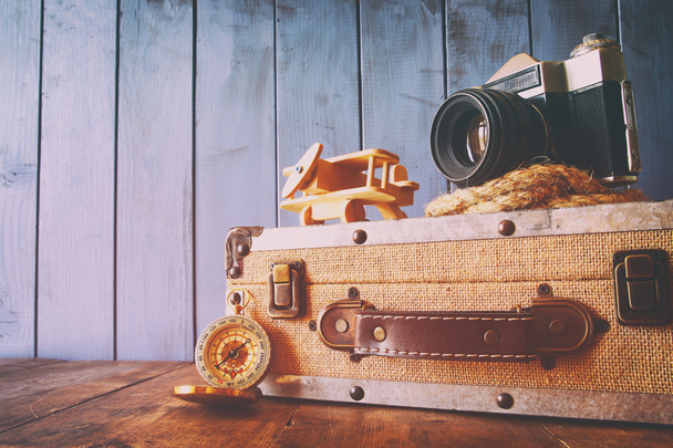 Compass, rope, old camera and toy plane. explorer concept - Valokuva, kuva