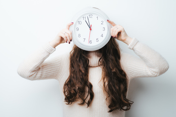 woman holding a clock - Photo, image