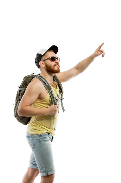 Side view of bearded traveler in sunglasses with backpack - Foto, Bild