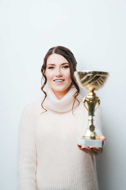 girl holding a prize cup - Foto, Imagen