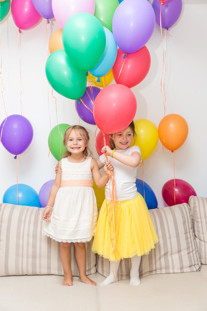 Two little girls at a birthday party - Zdjęcie, obraz