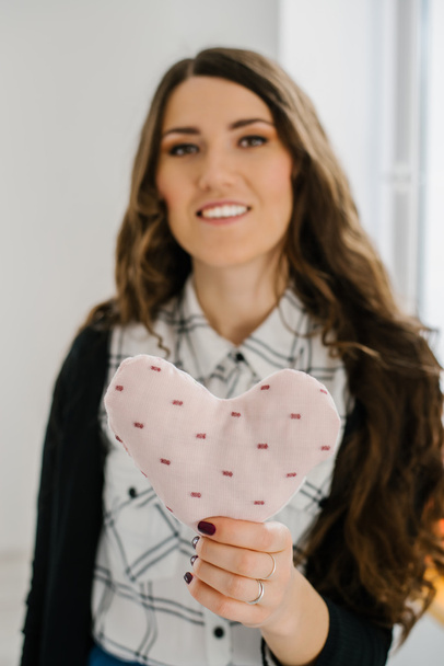 Woman holding toy heart - Photo, Image