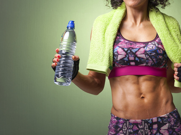 fit woman holding a bottle of water - Photo, Image