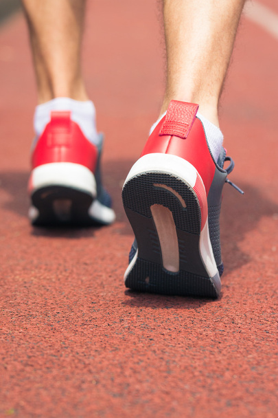 Close up of running shoes in use on the running track - Foto, imagen