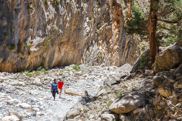 Samaria Gorge, Grece - MAY 26, 2016: Tourists hike in Samaria Gorge in central Crete, Greece. The national park is a UNESCO Biosphere Reserve since 1981 - Photo, Image