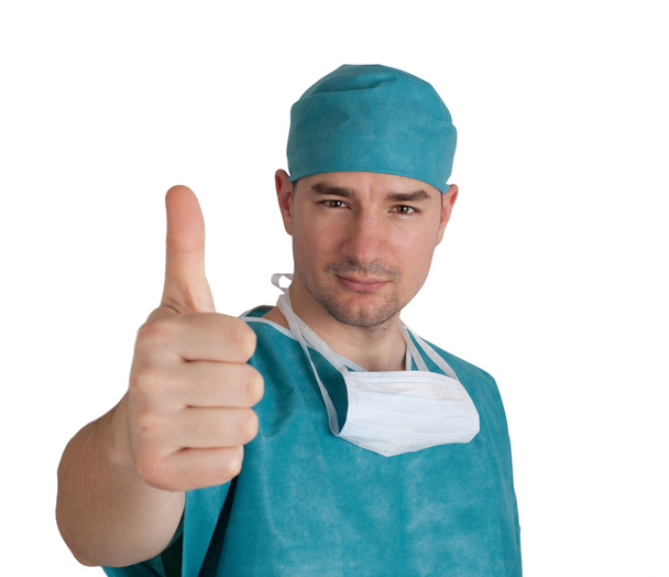 Doctor in scrubs thumb up - Foto, immagini