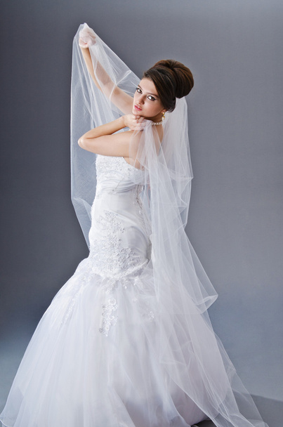Bride in wedding dress in studio shooting - Photo, Image