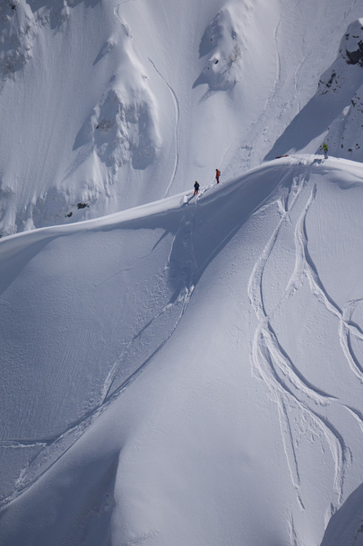 Snowboard freeride, snowboarders and tracks on a mountain slope. Extreme sport. - Photo, image