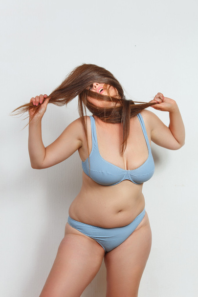 Fat woman posing in studio - Фото, изображение