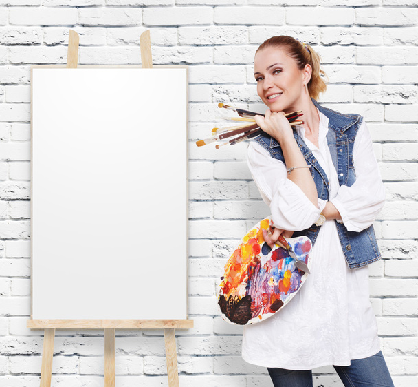 Woman artist with brushes, palette and copy space - Photo, Image