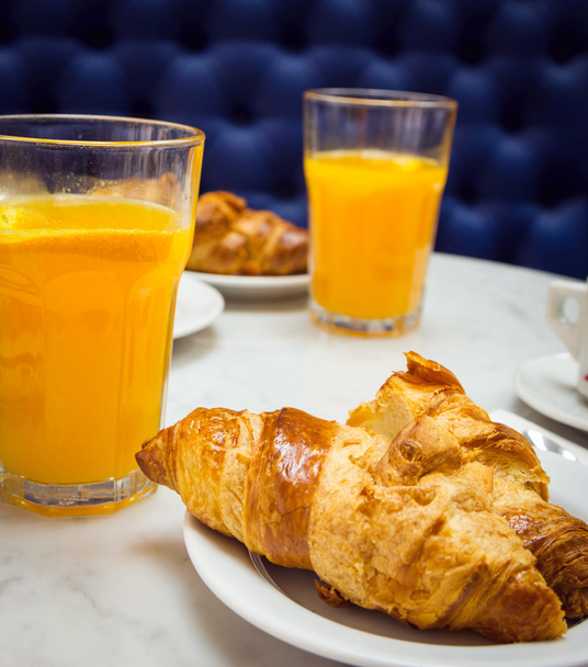 Breakfast with croissant and orange juice - Фото, изображение