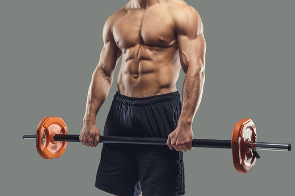 A man holding barbell - Photo, image