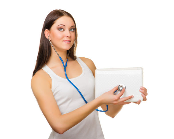 Young girl with laptop and stethoscope - Foto, Imagen
