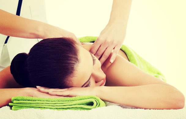 Woman relaxing beeing massaged in spa saloon - Fotó, kép