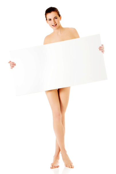 Young woman with empty board. - Valokuva, kuva