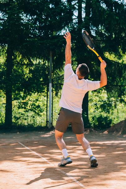 Male tennis player in action - Φωτογραφία, εικόνα