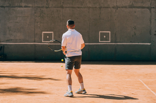 Tennis player training outdoors - Photo, Image