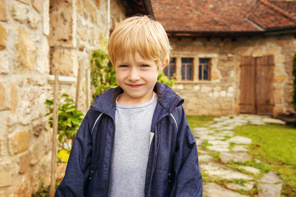 Little blond boy in countryside - Foto, immagini