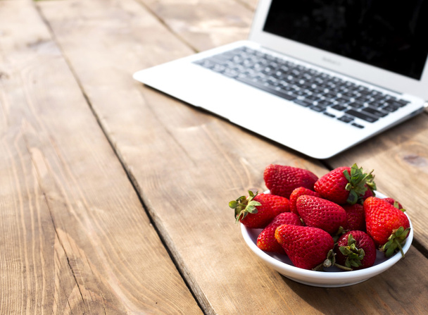 Bloggers workplace with strawberry - Photo, Image