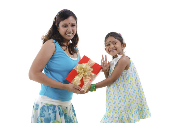Little Asian girl giving gift for mother - Foto, Imagem