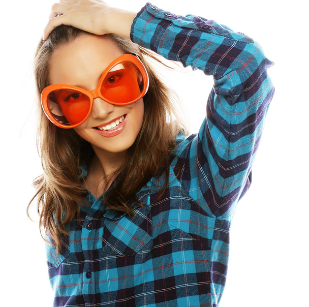 Playful young woman with big party glasses. - Photo, image