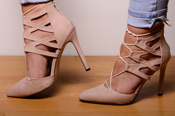 Light brown suede high-heeled shoes dressed in the girl - Photo, Image