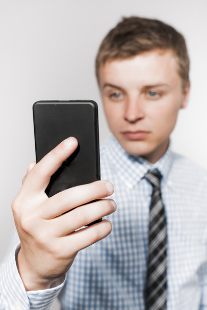 man  looking at smartphone - Foto, Imagen