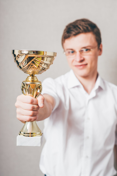 businessman with a golden cup - Foto, Imagen