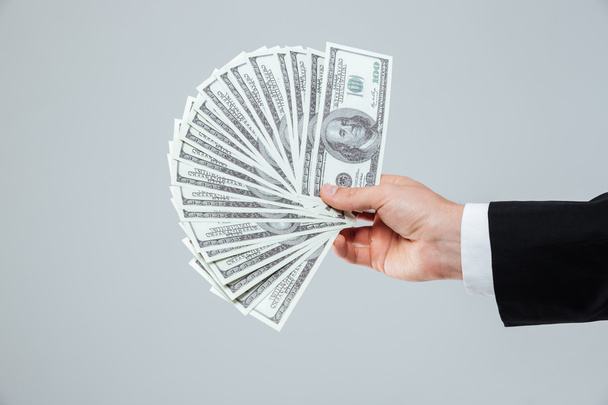 Hand of businessman holding money - Valokuva, kuva