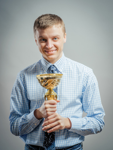 man with a prize cup  - Foto, immagini