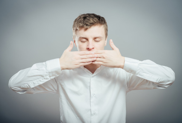 man keep his mouth closed by hands - Fotoğraf, Görsel