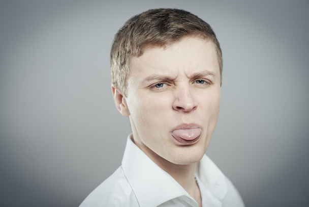  man showing his tongue - Photo, image
