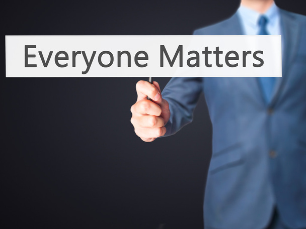 Everyone Matters - Businessman hand holding sign - Photo, Image
