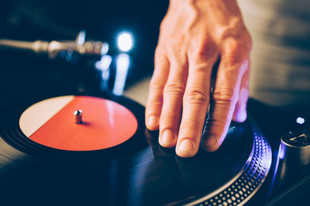 turntable scratch, hand of dj on the vinyl record - Photo, Image