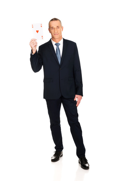 Elegant businessman with red ace card - Фото, изображение