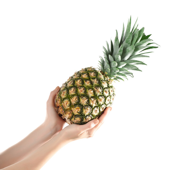 Woman hands holding pineapple - Foto, Imagen