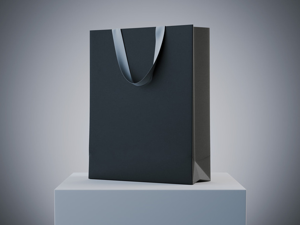 Black shopping bag on white podium. 3d rendering - Фото, зображення