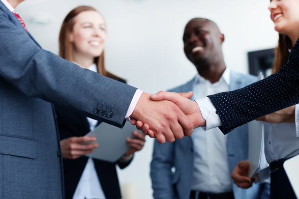 Business people shaking hands, finishing up a meeting - Foto, afbeelding