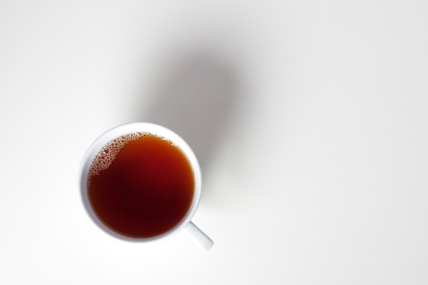 Cup with tea on white background. - Foto, Bild